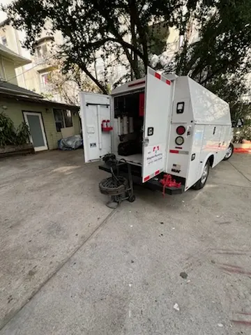 Magnet Plumbing service vehicle on-site for Grease Trap Cleaning in Regency Park Towers